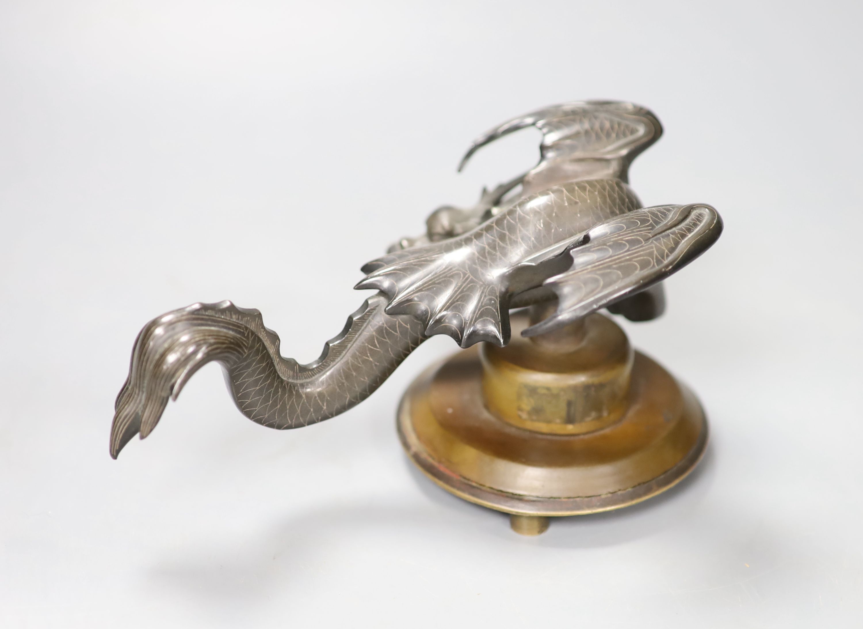 A Chinese bronze mounted dragon on stand, 18cm wide